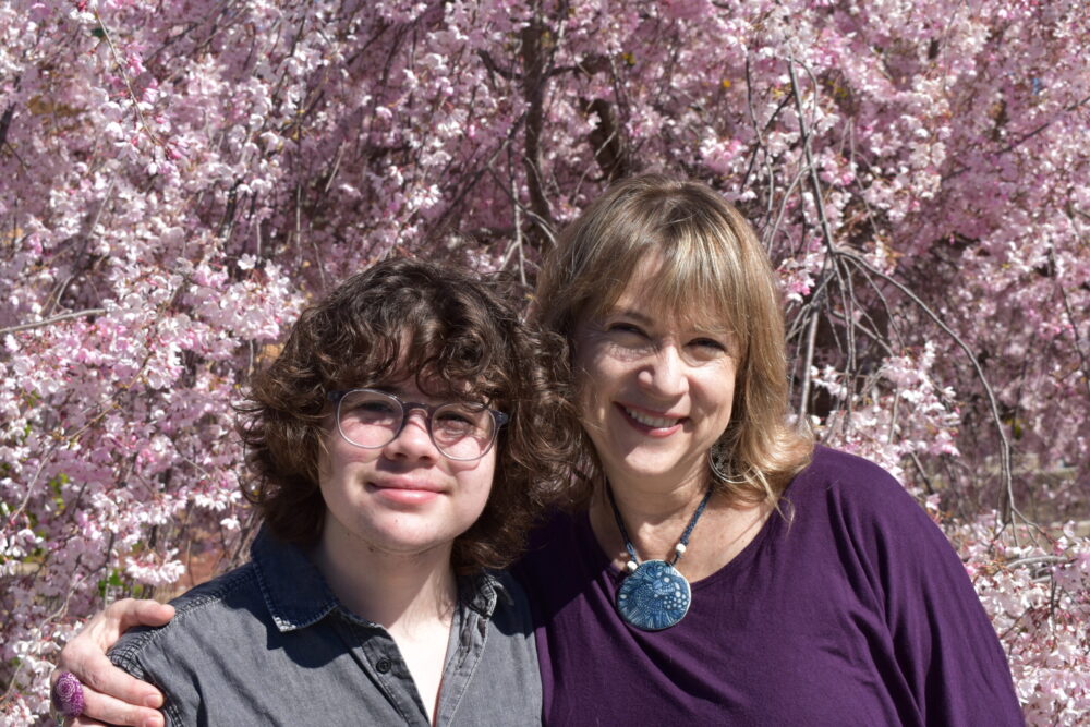 Nick with his Mum, Rachel, enjoying the Canberra blossom. Photo: Supplied 