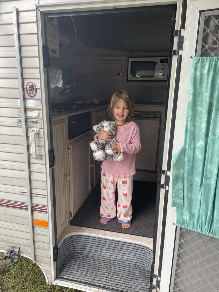 Lauren says: "This is our ‘new home’ for six months - a caravan." Pictured here is her daughter, Freya. Photo: Supplied 