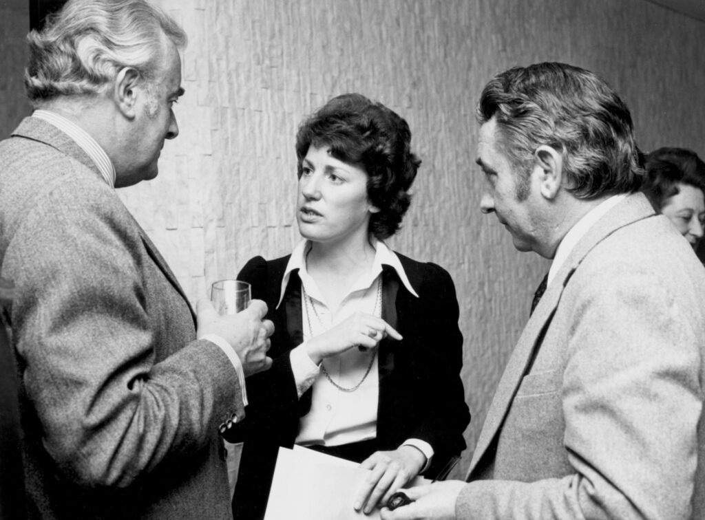 Prime Minister Gough Whitlam discusses International Women's Year with two members of the National Advisory Committee, Ms. Elizabeth Reid and the Secretary of the Australian Government's Department of the Media, Mr. James Oswin. Source: National Library of Australia obj-137047143