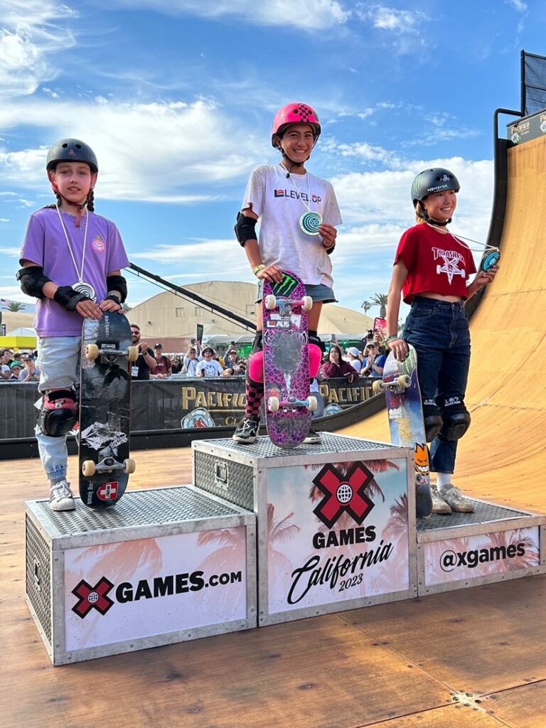 Photo of Arisa Trew receiving Gold at X-Games California, supplied by the Trew family. 