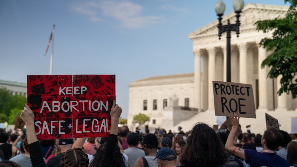 Washington, DC USA May 3 2022: Protesters gather at the US Supreme Court after a report that the count will overturn Roe vs Wade, ending the constitutional right to abortion.